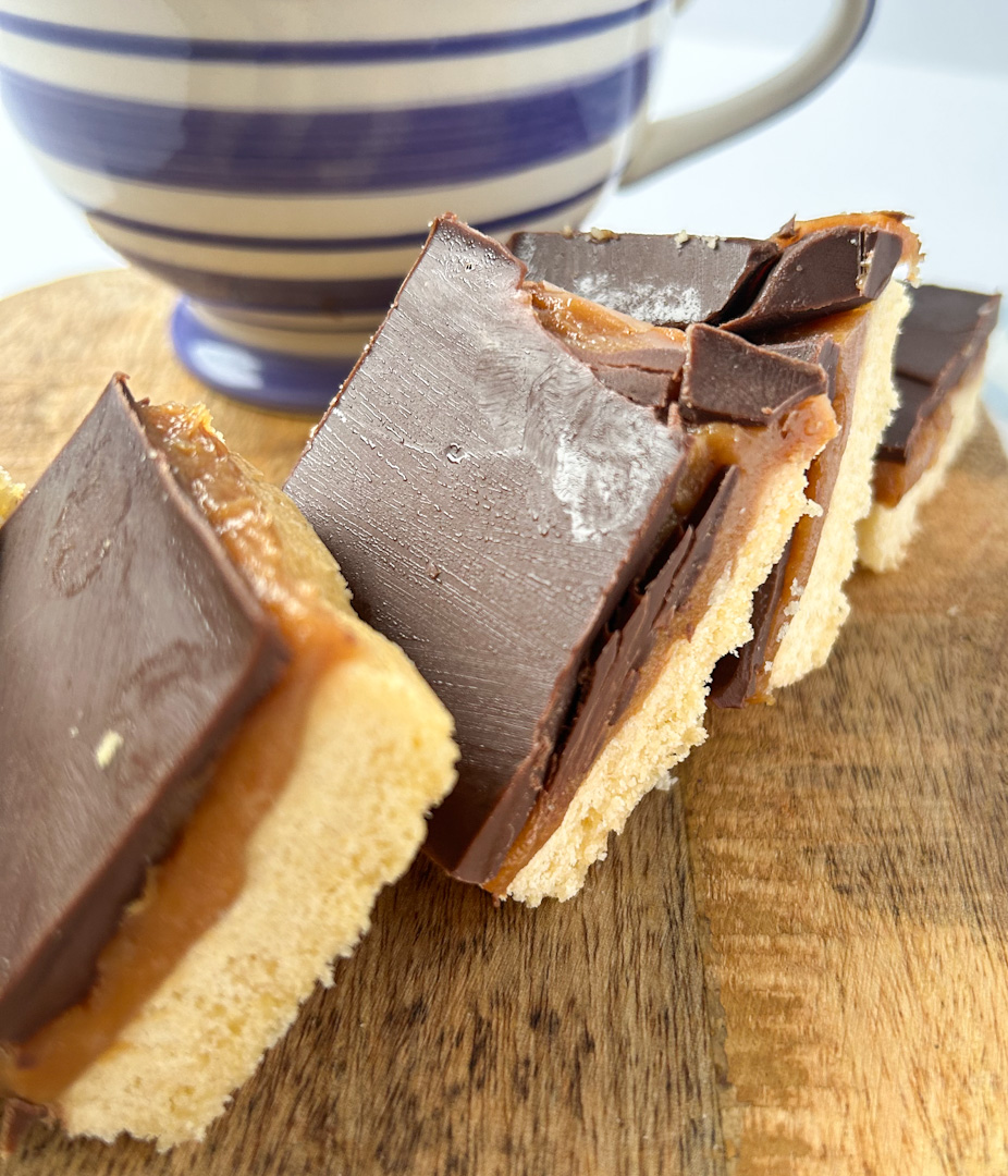 Millionaire shortbread tray bake with a cup of tea